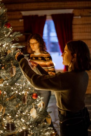 Decorating the Christmas tree in the house of Mrs. Santa Claus